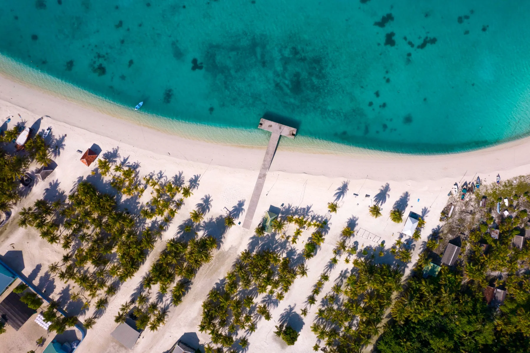 Aerial view of white sand and clear lagoon